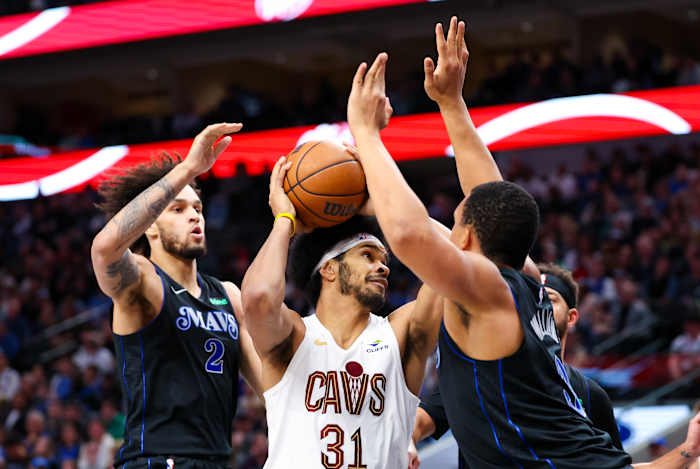 Dec 23, 2023; Dallas, Texas, USA; Cleveland Cavaliers center Jarrett Allen (31) looks to shoot as Dallas Mavericks center Dereck Lively II (2) and Dallas Mavericks forward Grant Williams (3) defend during the second quarter at American Airlines Center. Mandatory Credit: Kevin Jairaj-USA TODAY Sports